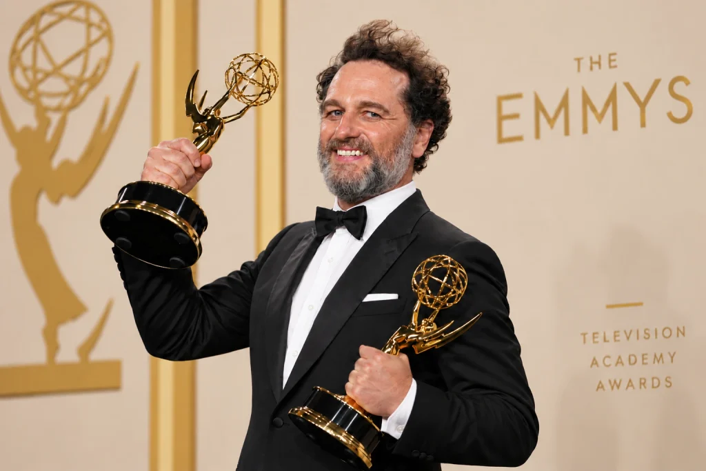 Matthew Rhys poses in the press room with the awards for outstanding lead actor