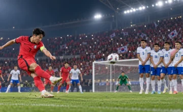 Son Heung-min takes a free kick against Uzbekistan